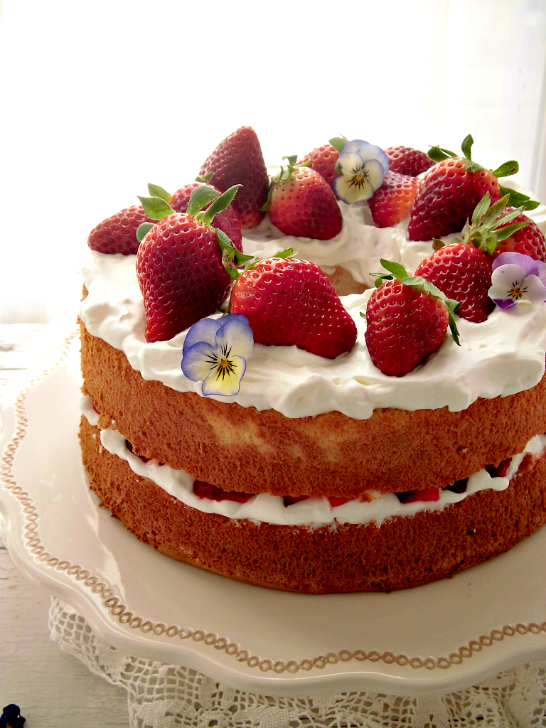 Angel food cake with cream and strawberries.jpg